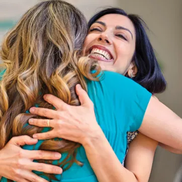 Two women embracing at the Y